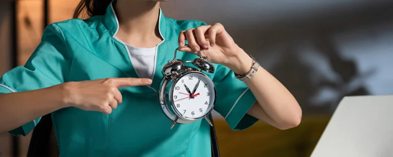 Person holding clock