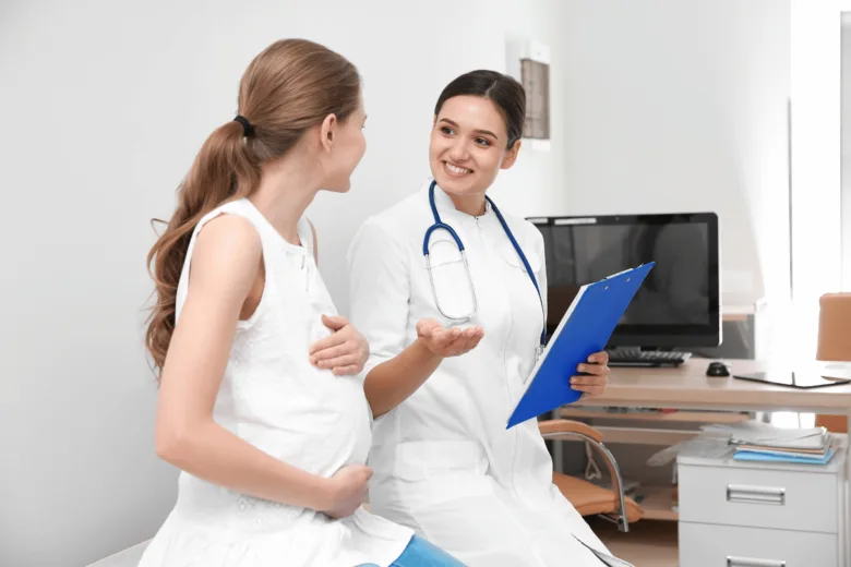 Pregnant woman and doctor