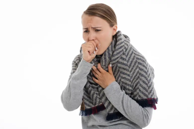 Woman coughing with scarf