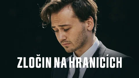 Muž v obleku hledí dolů s nadpisem o zločinech na hranicích.