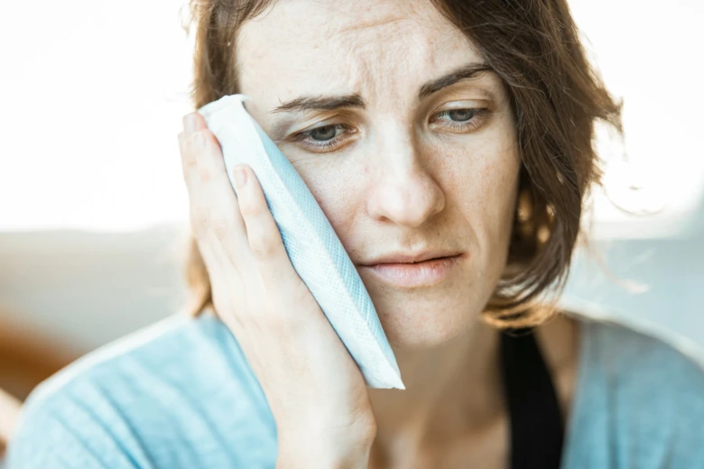 Woman with headache relief pad