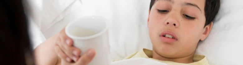 Ill child with cup