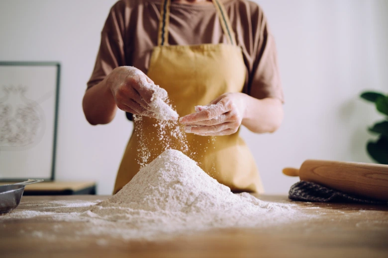 Person preparing flour