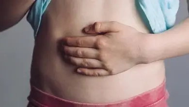 Child holding stomach