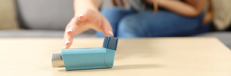 Asthma inhaler on table