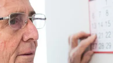Elderly man with calendar
