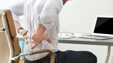 Man holding lower back pain