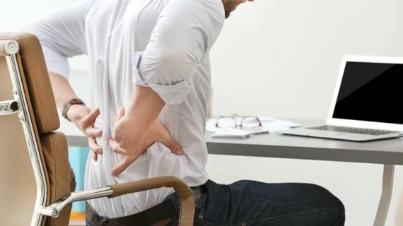 Man holding lower back pain